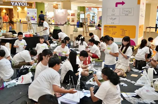 Dozens of young makers creating together at an Art-Tech event